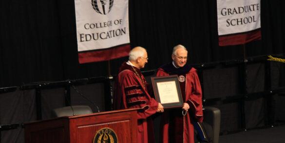 Walker receiving the Doctor of Laws from Troy University