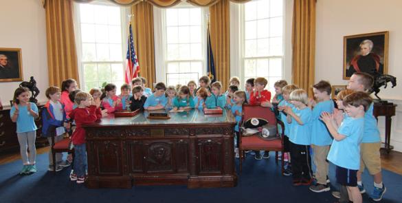 kids signing in the Oval Office