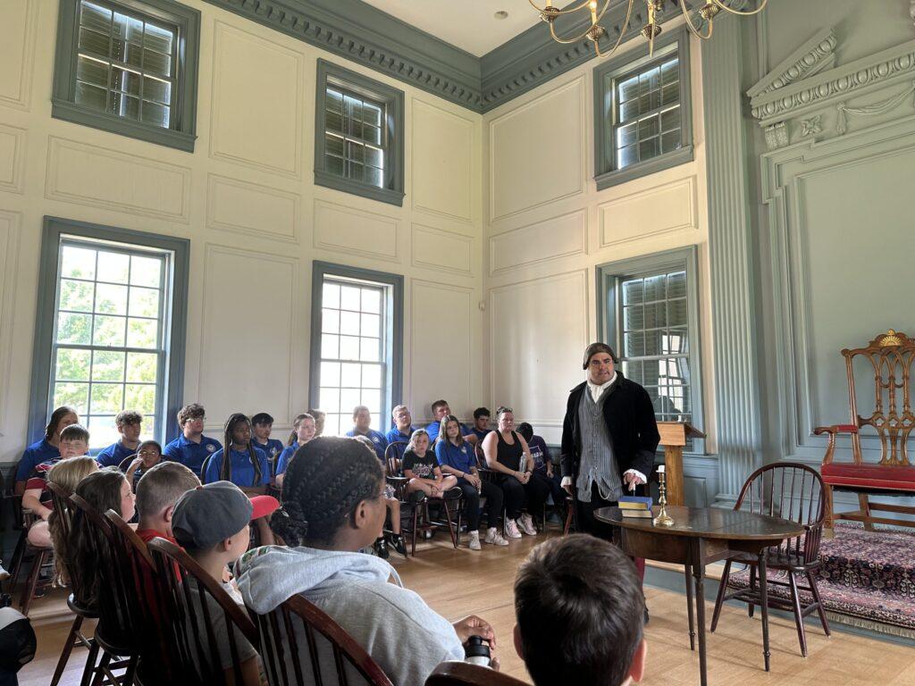 John Adams performs at American Village