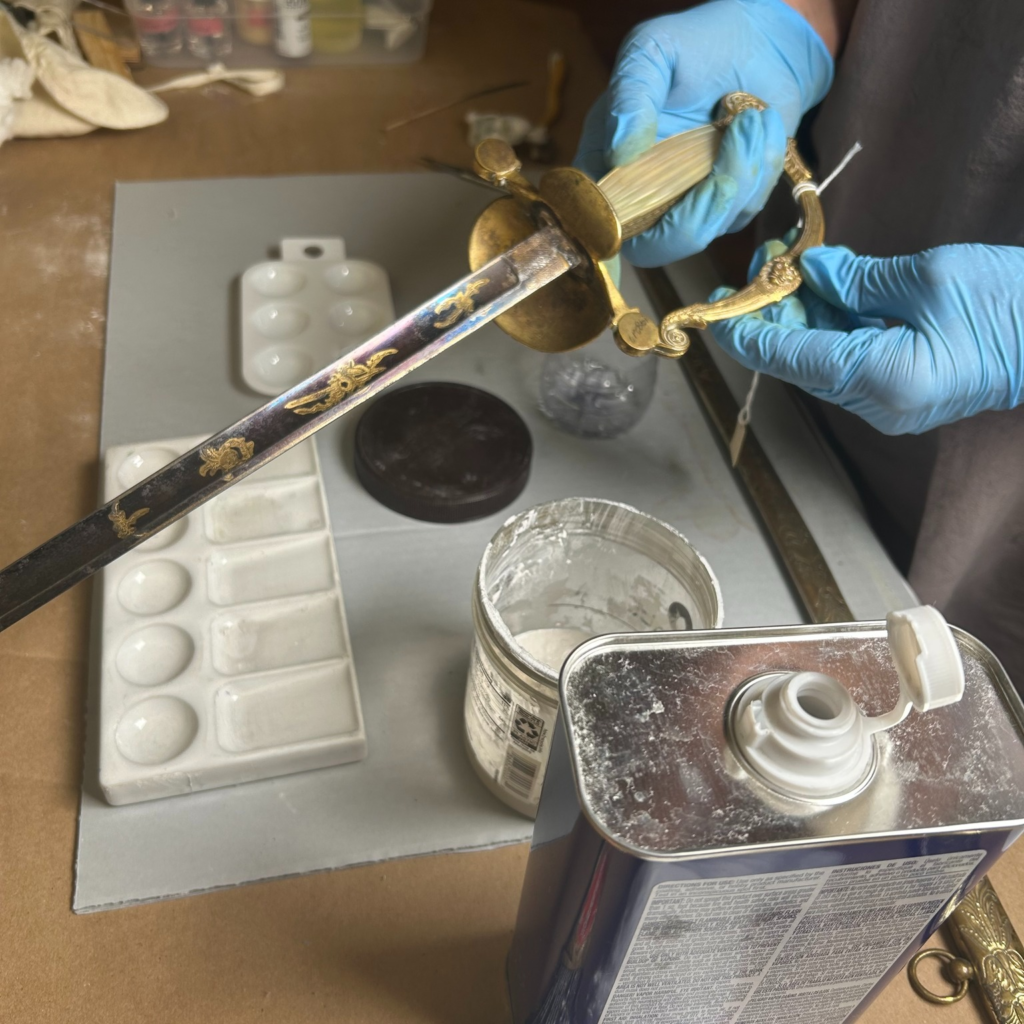 cleaning Washington's sword