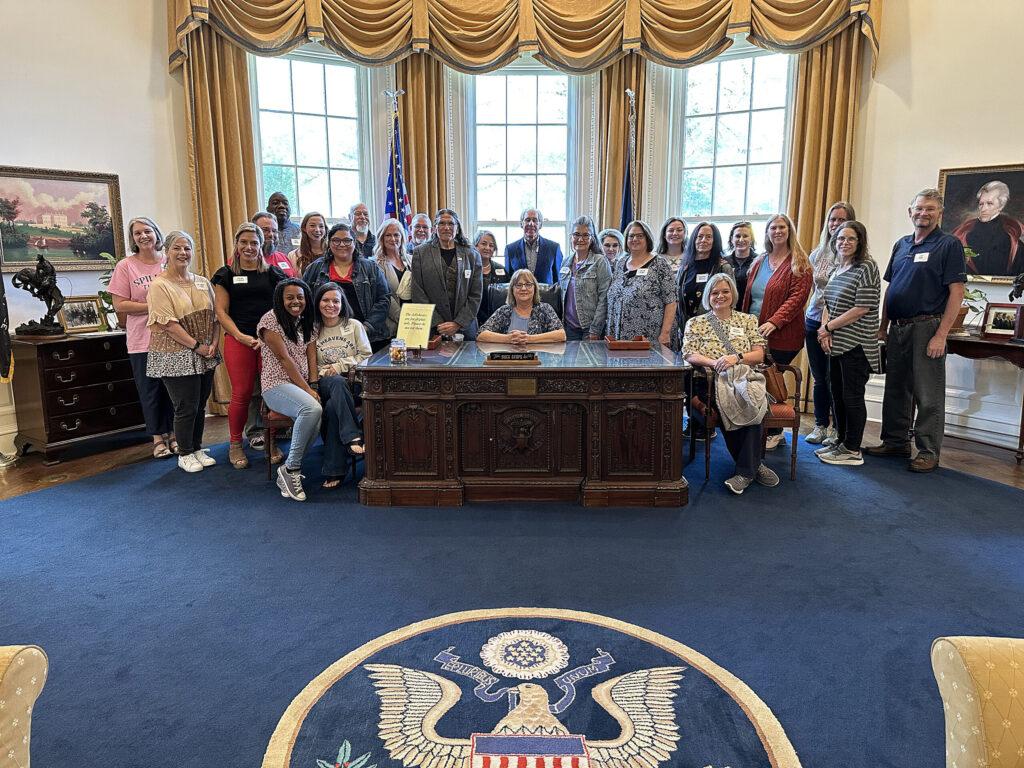Teacher workshop group photo in the Oval Office