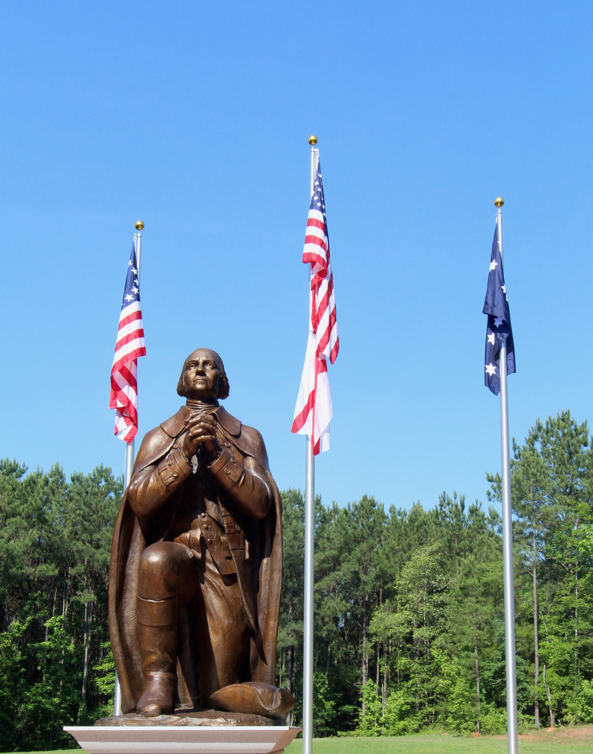 statue with flags